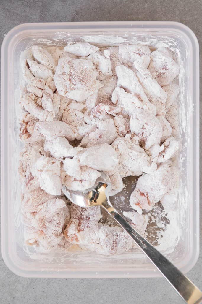 coating chicken thigh pieces in corn starch