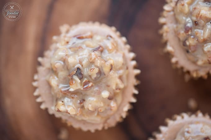 looking down at mini German Chocolate Cake cheesecakes with pecan topping