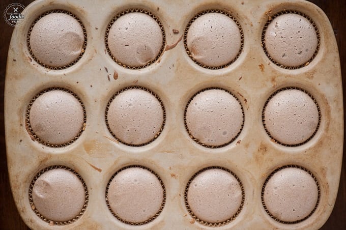 a stone muffin pan with chocolate cheesecakes