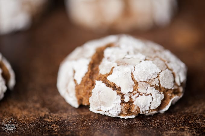 A close up of a gingerbread crinkle Christmas cookie