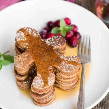stack of Gingerbread man Pancakes with syrup