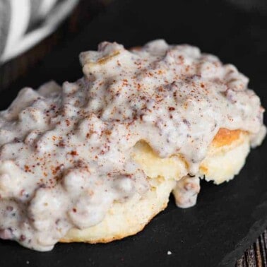 biscuit split in half topped with gluten free country sausage gravy