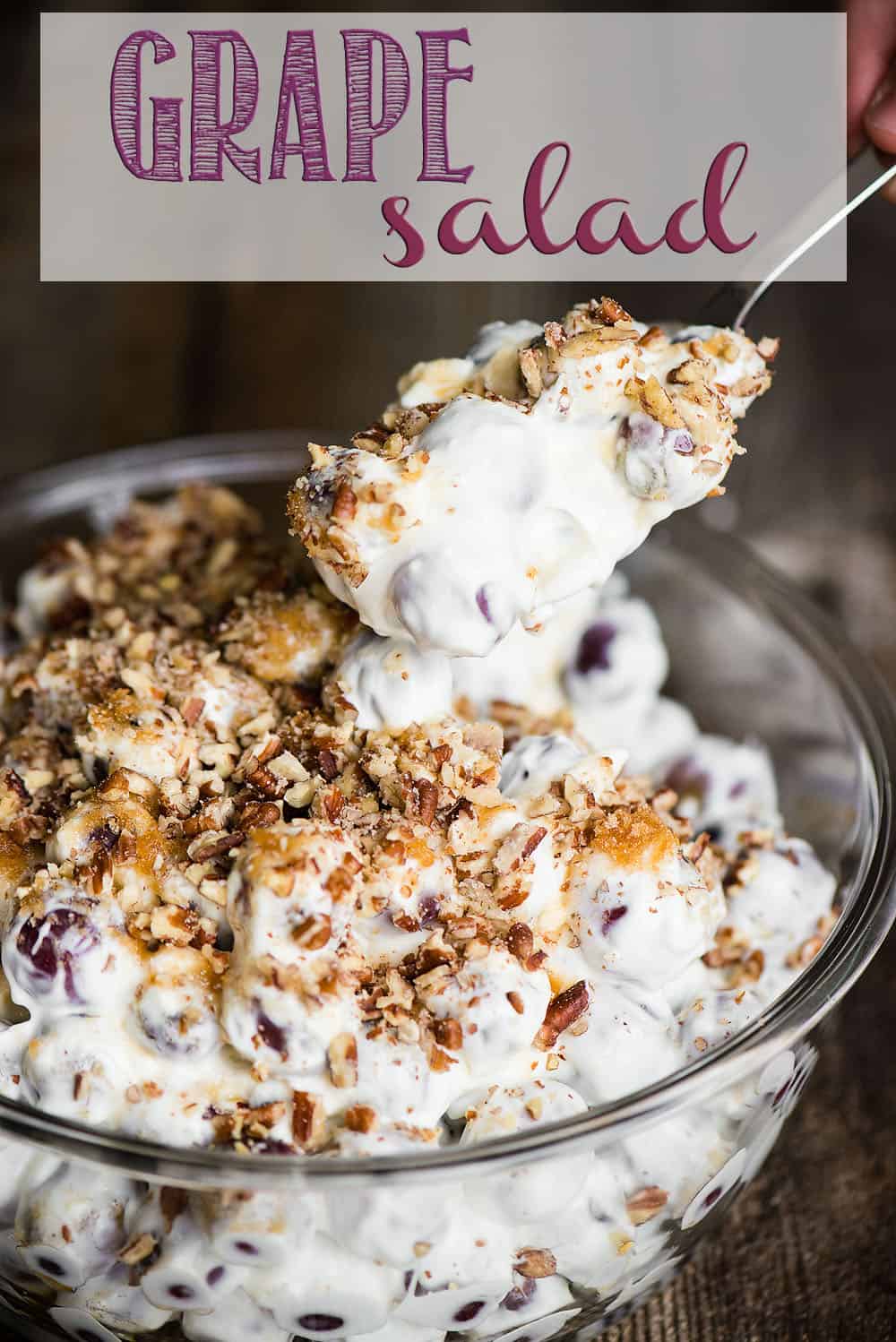 Grape Salad, made with a mixture of fresh grapes smothered in sweetened cream cheese and sour cream topped with brown sugar pecans, is the perfect potluck side dish! #grape #grapesalad #potluck #sidedish