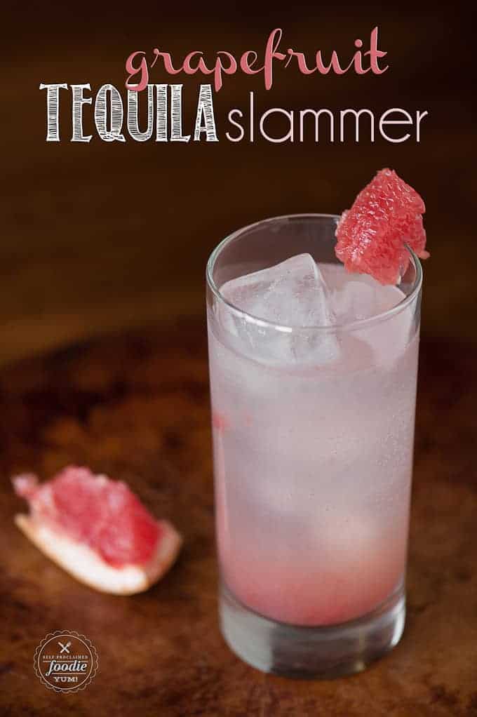 grapefruit cocktail in tall glass with grapefruit garnish