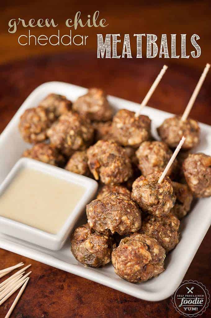 Homemade meatballs with toothpicks and cheese sauce on the side