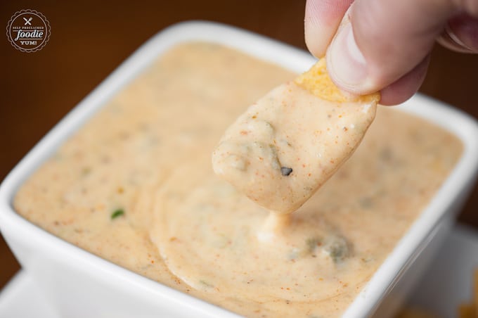 corn chip in spicy queso