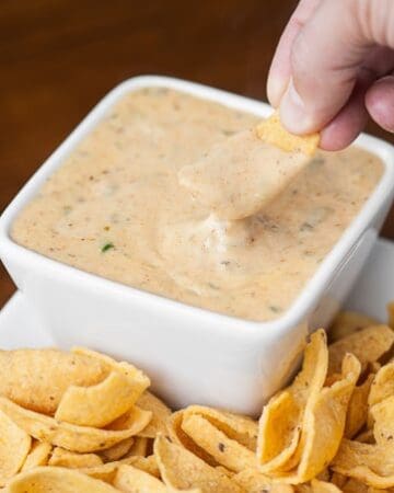 This spicy and creamy Green Chile Cheddar Queso made with real sharp cheddar cooks up in just minutes and is the perfect cheese sauce for nachos or tacos.