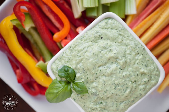 top down look at green goddess dip with lots of cut vegetables