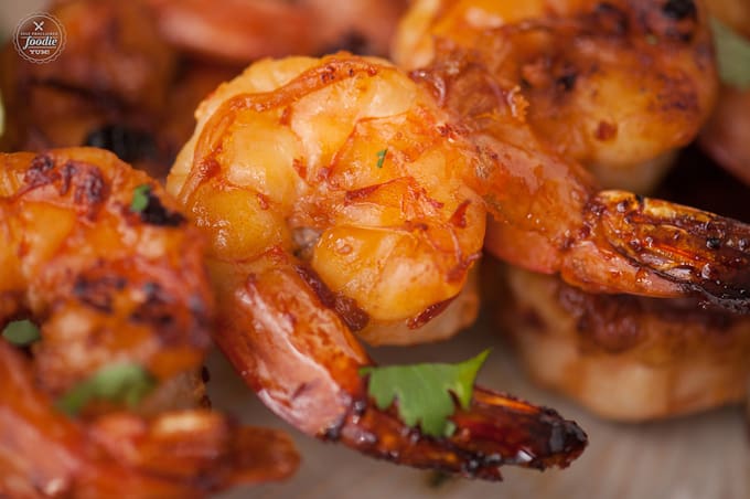 a close up of chipotle shrimp skewers