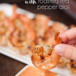 a close up of grilled shrimp with roasted red pepper aioli