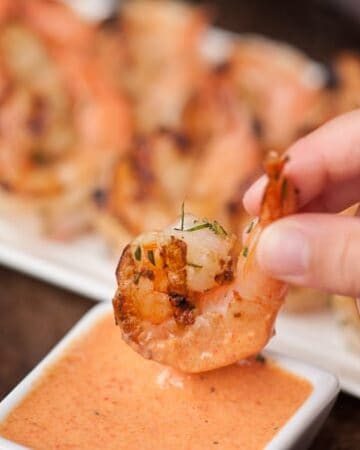 This red pepper marinated Grilled Shrimp with this scratch made Roasted Red Pepper Aioli makes the perfect flavorful summer appetizer or dinner.