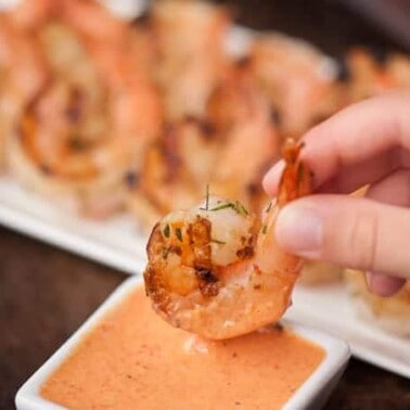 This red pepper marinated Grilled Shrimp with this scratch made Roasted Red Pepper Aioli makes the perfect flavorful summer appetizer or dinner.