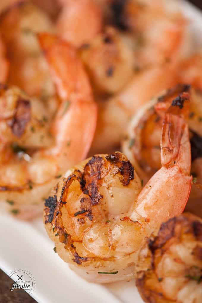 A close up of shrimp on a plate, with Aioli 