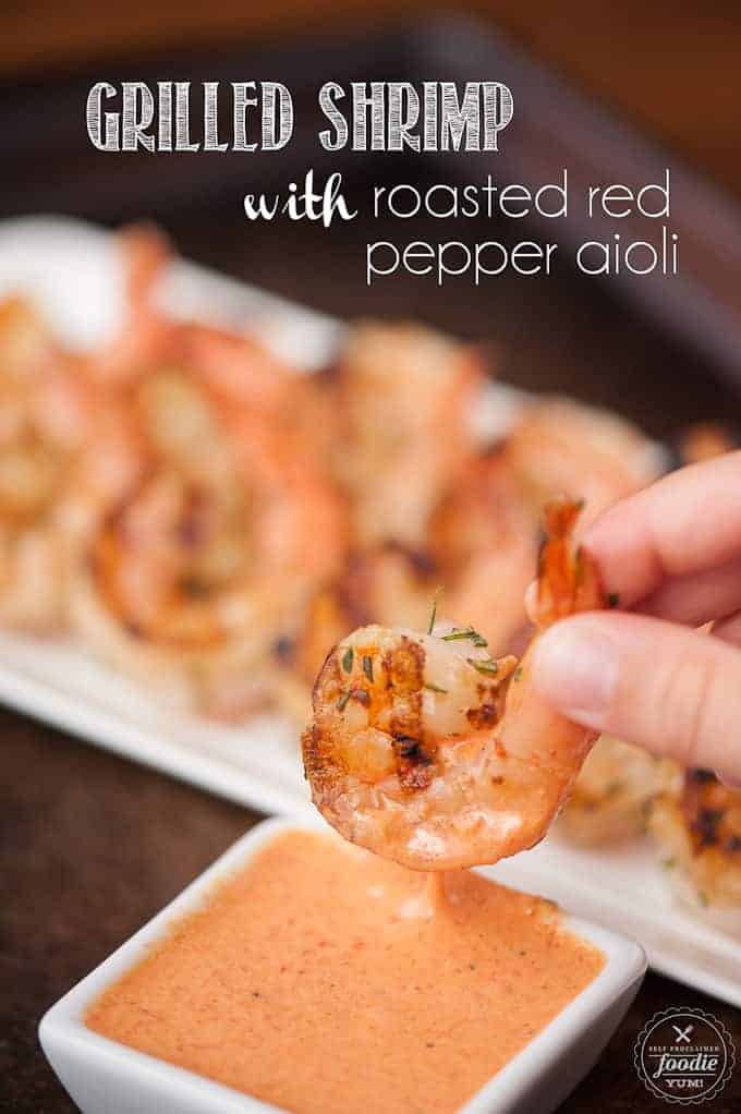 a close up of grilled shrimp with roasted red pepper aioli