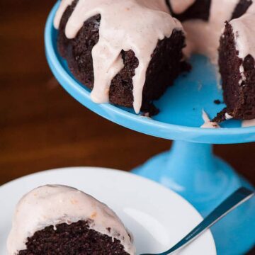 Guinness Chocolate Cake, cooked in a bundt pan and topped with blood orange frosting, is a rich and decadent dessert perfect for St. Patrick's Day.