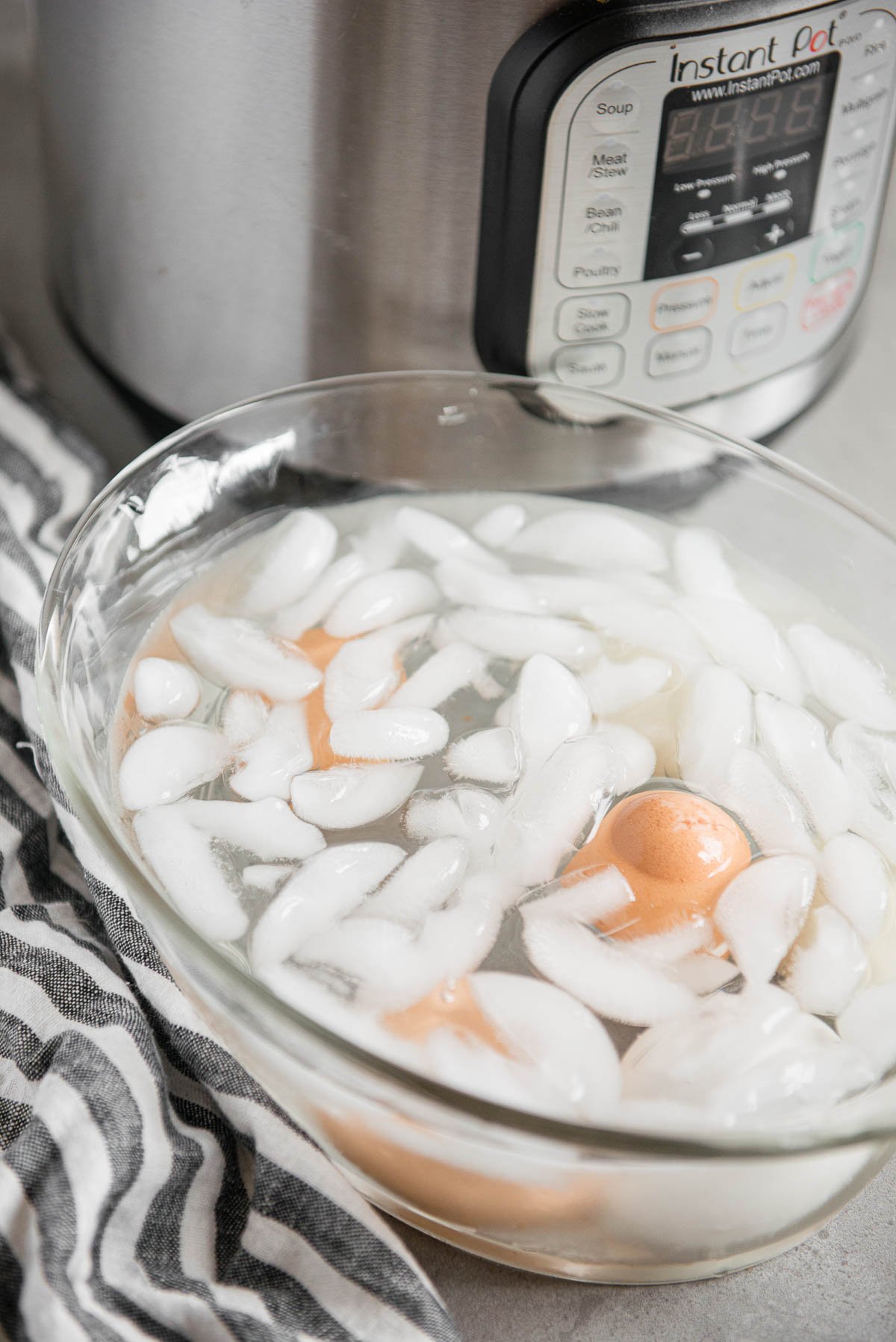 setting hard boiled eggs in ice bath.