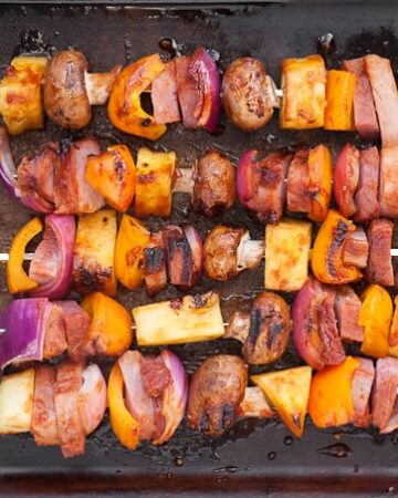 Hawaiian Ham Skewers, made with a pineapple grilling sauce, ham steak, and fresh vegetables, are not only insanely delicious but are super easy to make.