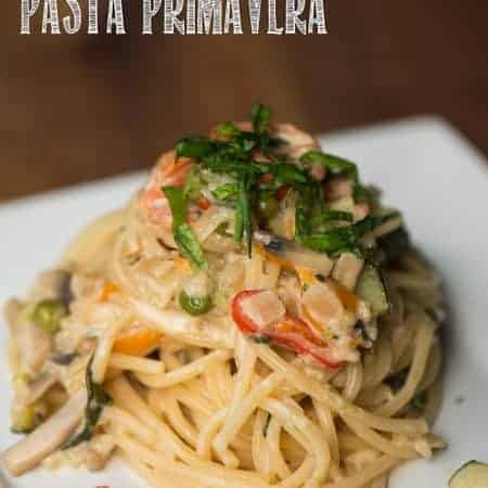 Eat the rainbow with this creamy yet quick and easy to make Dozen Veggie Pasta Primavera! The texture of the pasta and flavor in the sauce is incredible!!!