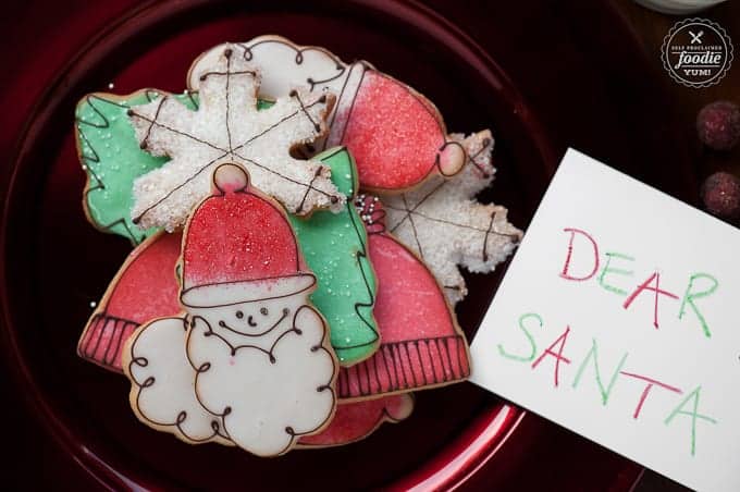 plate of decorated homemade cut out sugar cookies for santa