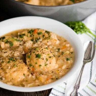 Homemade Chicken and Dumplings, with tender chicken, vegetables, and scratch made drop dumplings, is the kind of comfort food we crave. This meal has the same great taste as a homemade chicken soup, but the fluffy dumplings make it a filling and savory meal. Chicken and Dumplings is an old fashioned favorite recipe.