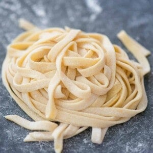 pile of thick cut homemade pasta noodles.