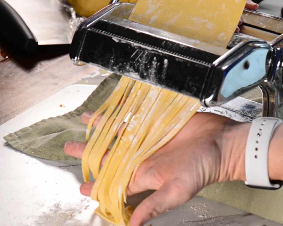 cutting homemade homemade pasta noodles.