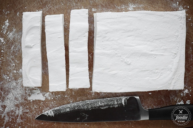 cutting homemade  peppermint flavored marshmallows