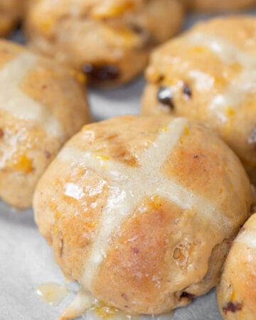 warm hot cross buns with orange glaze.