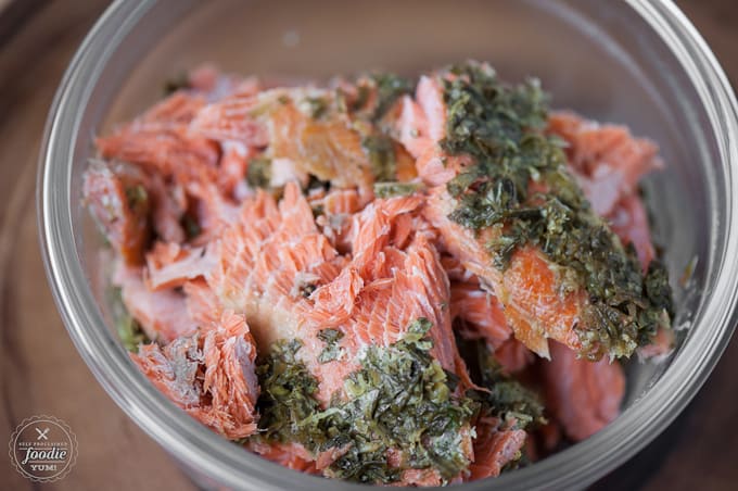 A bowl of smoked salmon with herbs