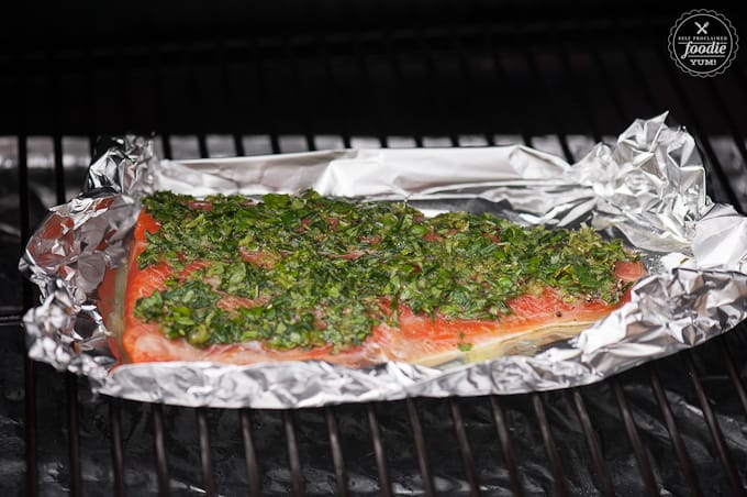 salmon filet with herb mixture on grill