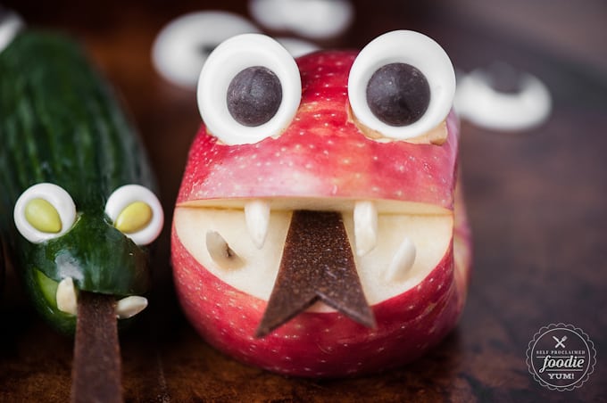 candy googly eyes in an apple