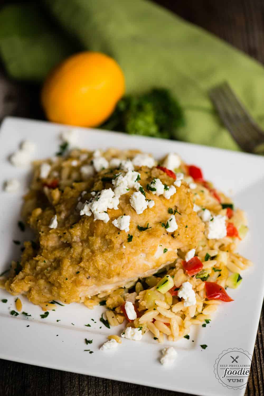 Hummus baked chicken with feta and vegetable orzo