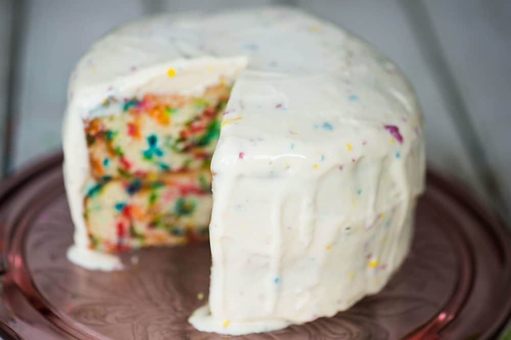 A close up of a birthday cake on a table