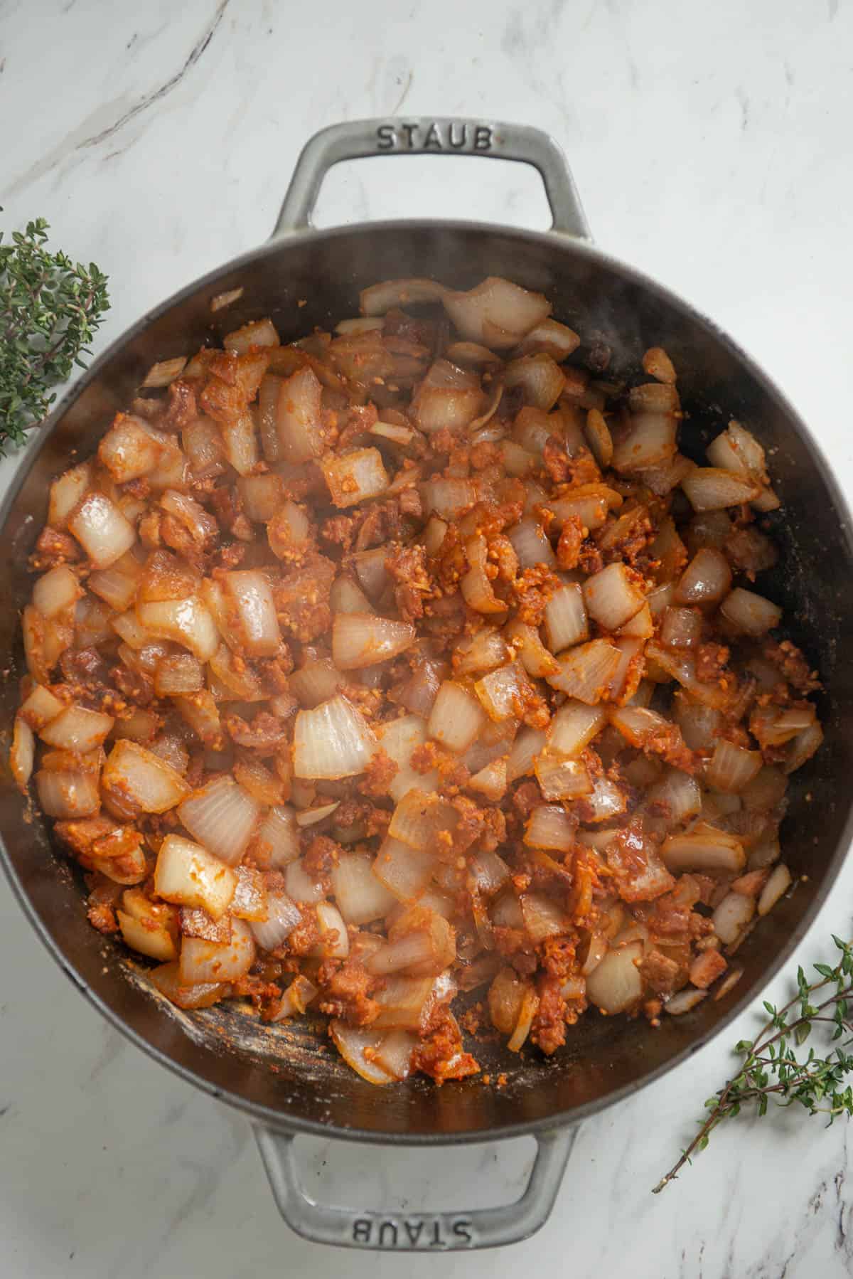 onions and garlic with flour and tomato paste for Irish stew recipe.