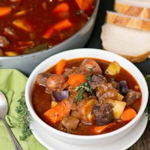 bowl of homemade Irish stew with sliced bread.