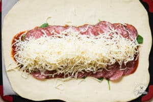 making an Italian stromboli with mozzarella