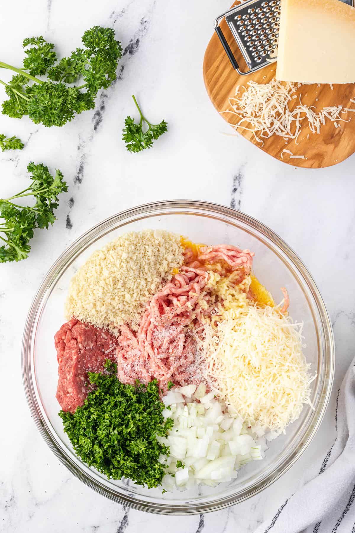 meatball ingredients in large bowl.