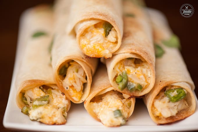 melted cheese coming out of baked chicken jalapeno flautas 