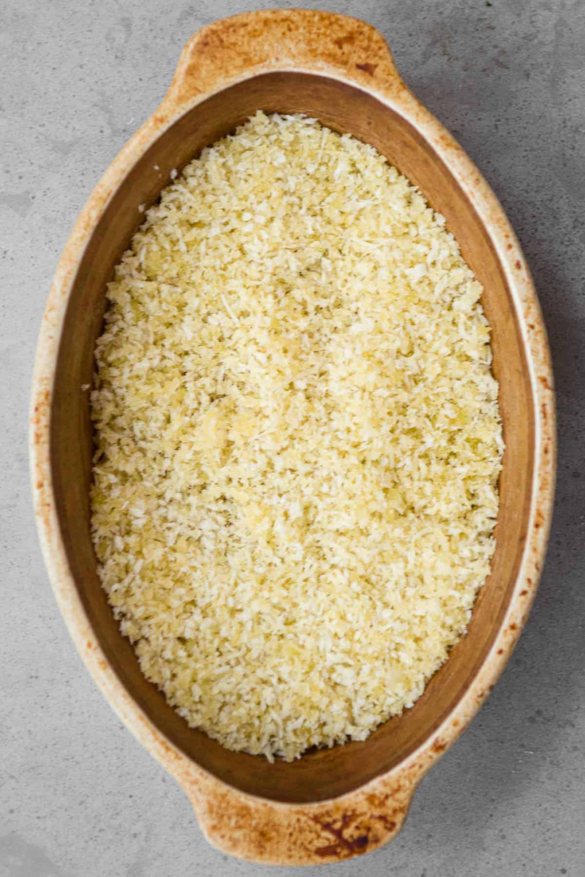 panko bread crumbs tossed in olive oil in oval dish