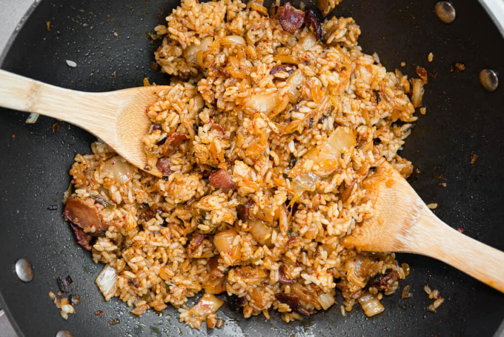 kimchi fried rice with bacon in wok pan