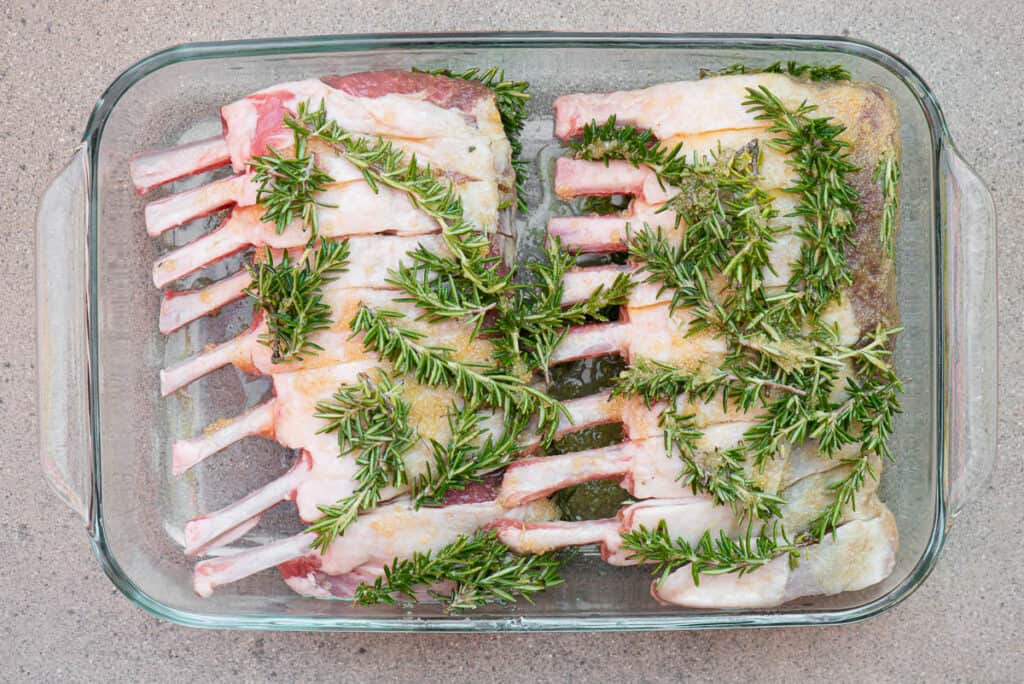 rack of lamb with rosemary in dish