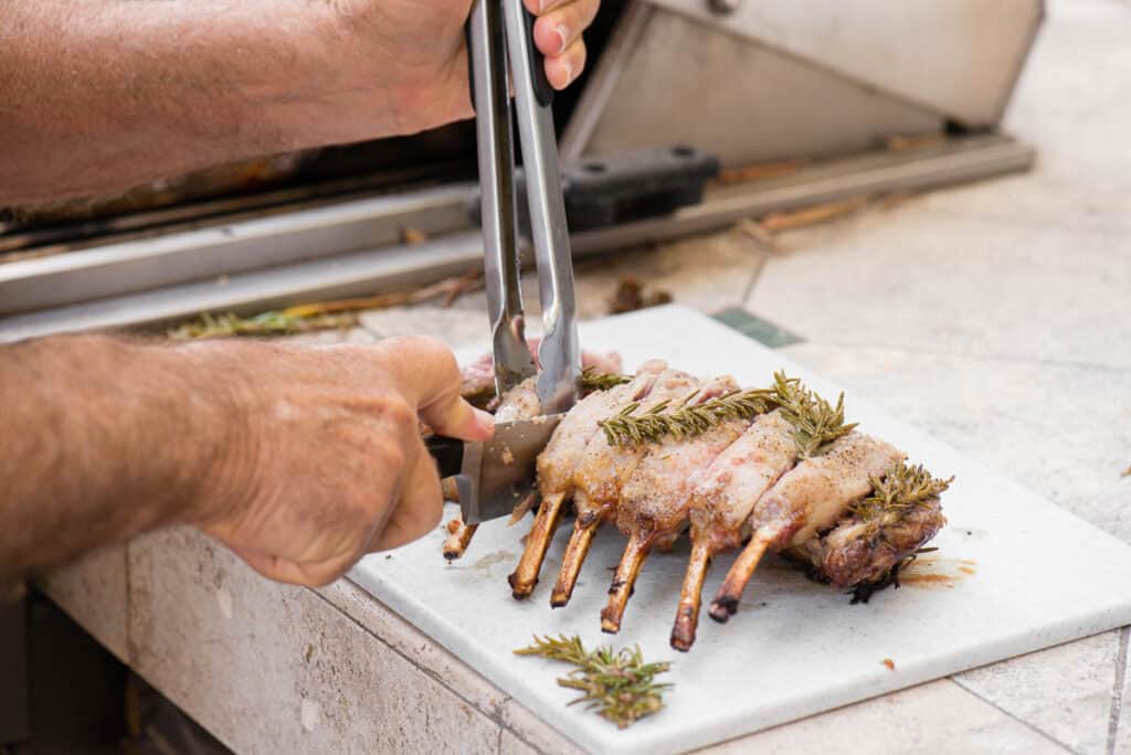 slicing rack of lamb into chops
