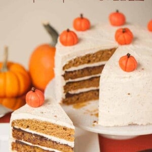 The best delicious fall dessert is this moist homemade Layered Pumpkin Cake with hazelnut buttercream, drunken chocolate ganache, and marzipan pumpkins!