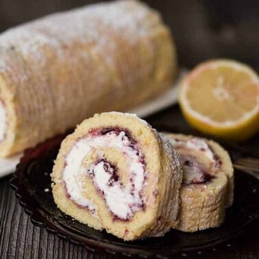 Lemon Lingonberry Jam Cake Roll is a lovely and delicious dessert consisting of scratch made lemon cake, sweet lemon cream, and tart lingonberry preserves.