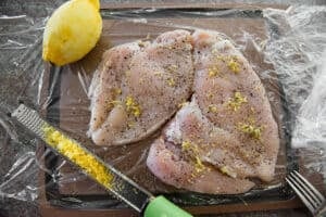 lemon zest and pepper on chicken breast