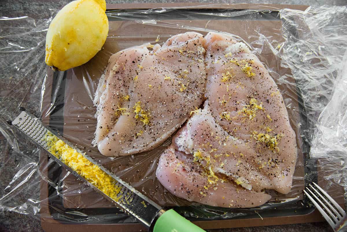 lemon zest and pepper on chicken breast