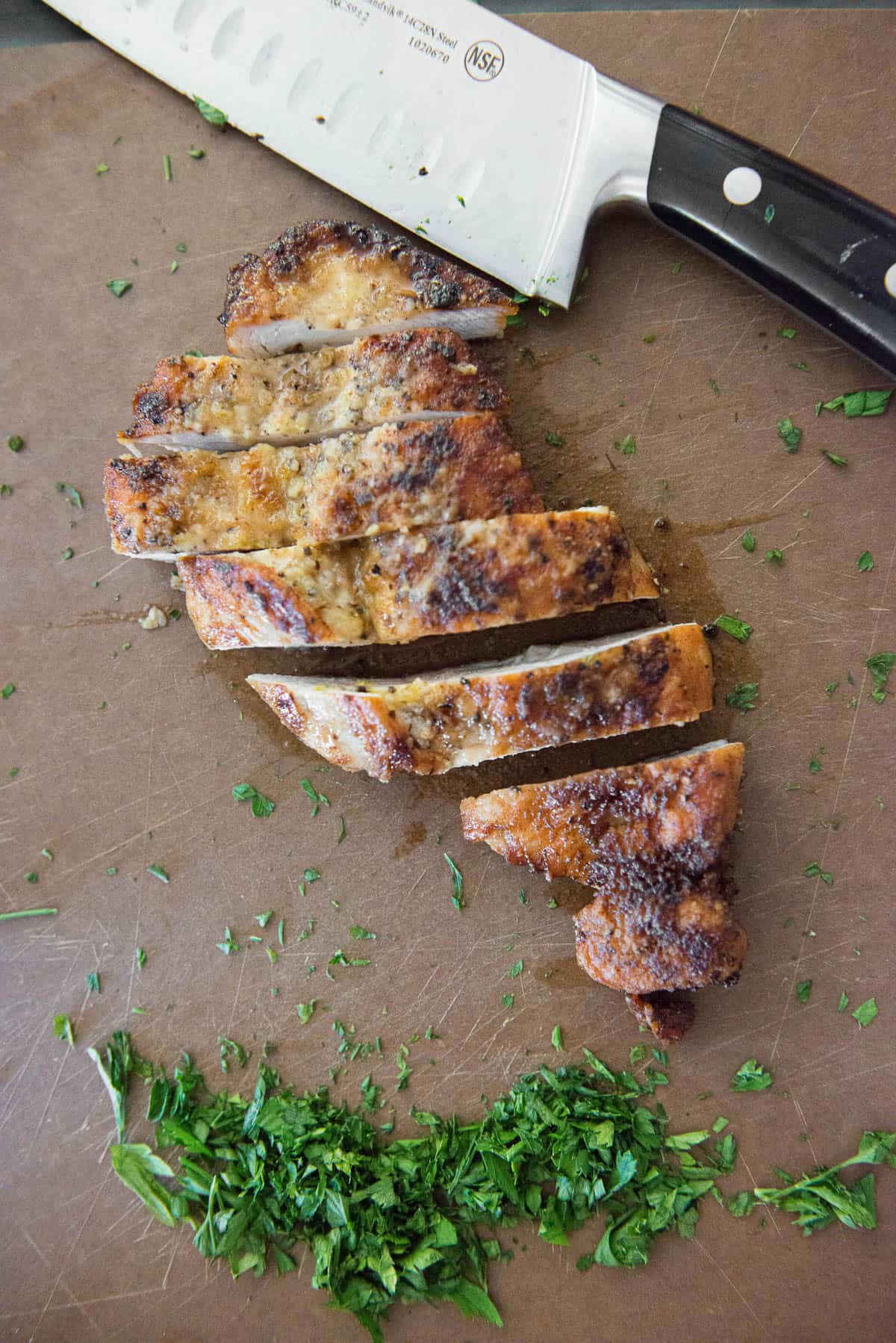 sliced chicken breast on cutting board