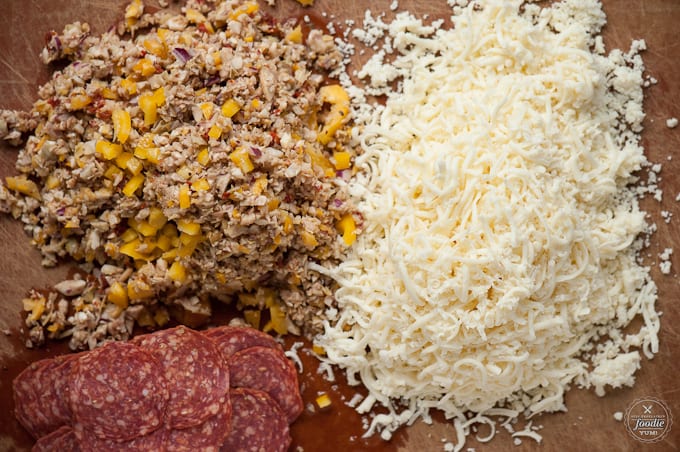 pizza ingredients on a cutting board