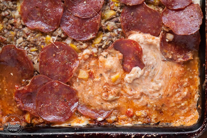 A close up of a pan of pizza dip