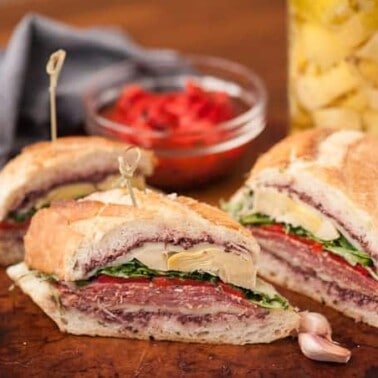 Just imagine how tasty these mouthwatering cured meats, marinated veggies, fresh greens, and melty cheese on this Loaded Grilled Italian Sandwich taste!